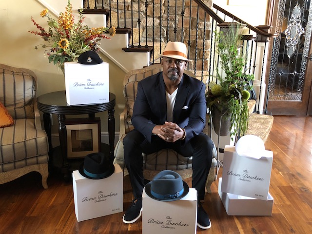 Brian Dawkins poses with exclusive hat collection